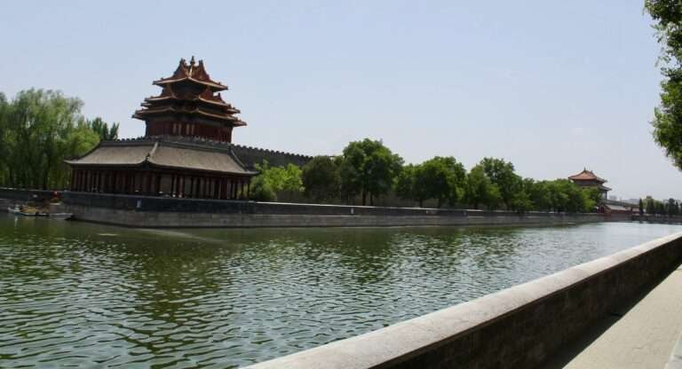 Molly from Mollywozhere travel blog outside the Forbidden City and moat, Beijing, China.