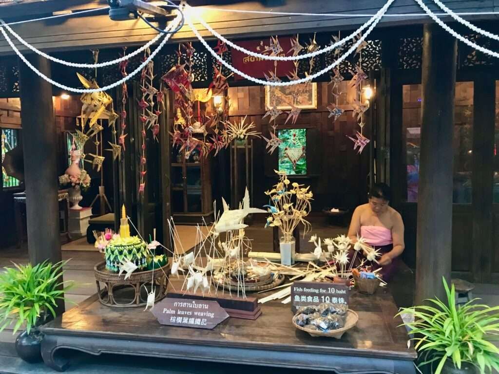 Molly from Mollywozhere travel blog exploring the traditional village at Siam Niramit, Bangkok.