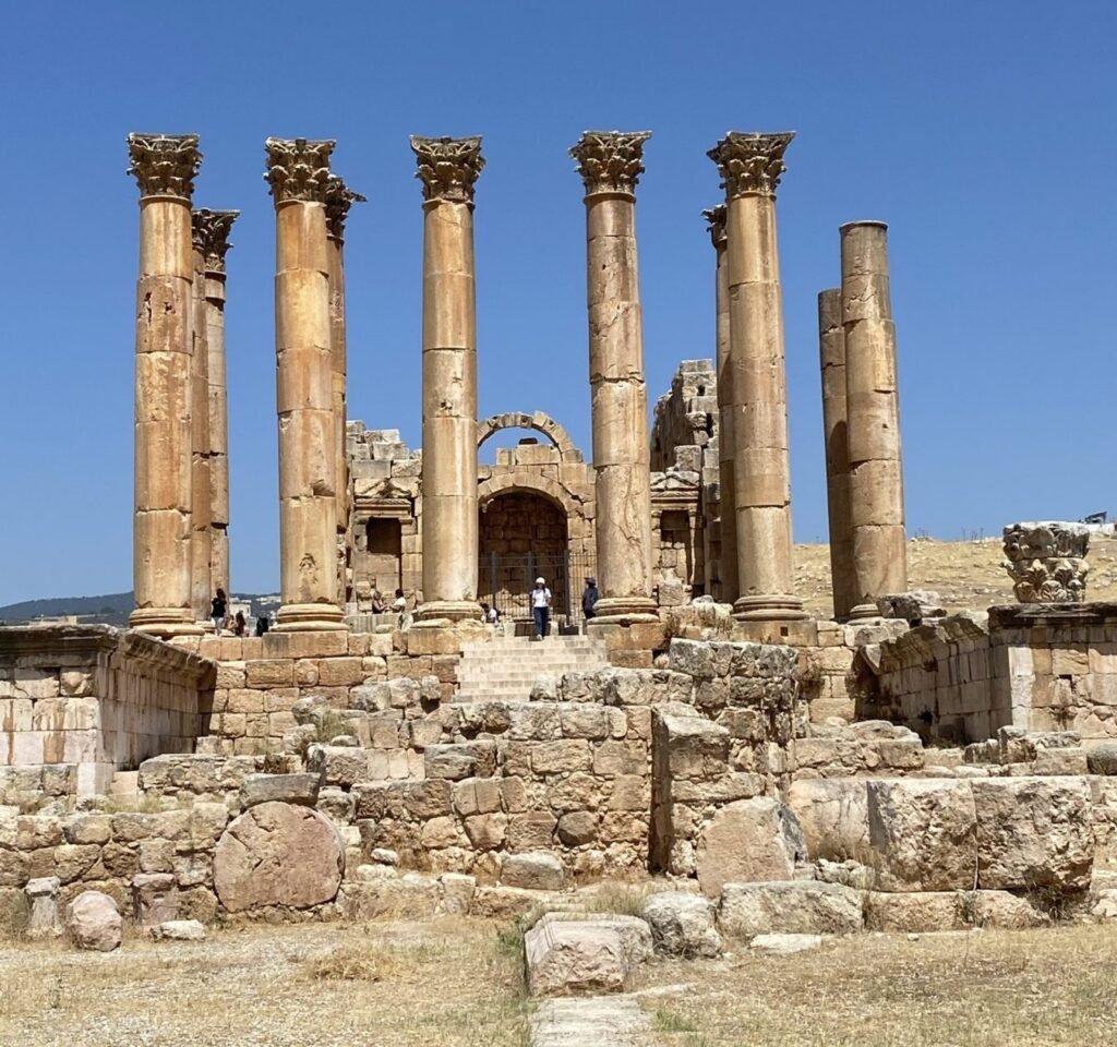 Molly from Mollywozhere travel blog standing in front of the Temple of Artemis, Jerash, Jordan.