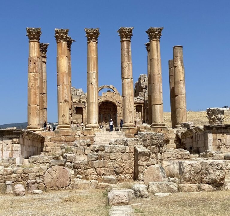 Molly from Mollywozhere travel blog standing in front of the Temple of Artemis, Jerash, Jordan.
