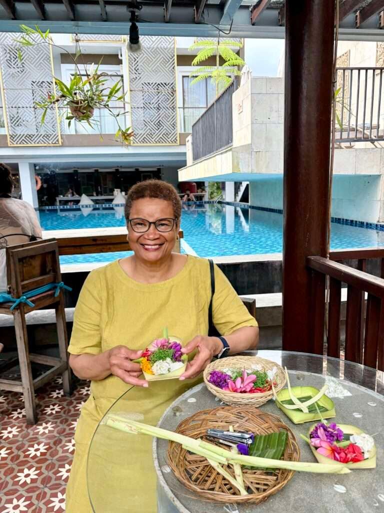 Molly of Mollywozhere making colourful Canang Sari for daily ritual in Bali,Indonesia.