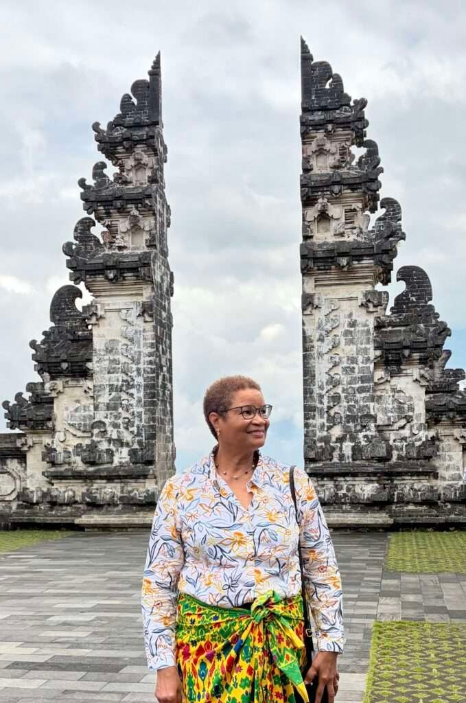 Molly from Mollywozhere travel blog standing in front of the gates in Lempuyang Temple, Bali.