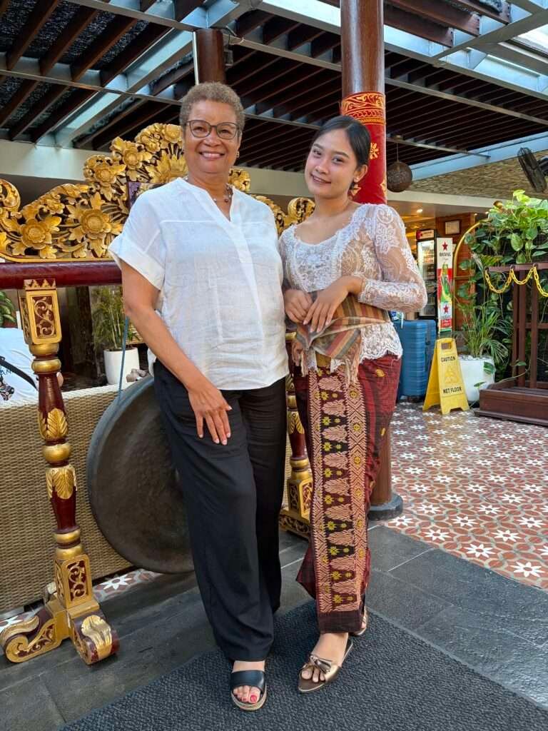 Molly from Mollywozhere travel blog talking to a local Balinese lady in her traditional dress for Galungan.