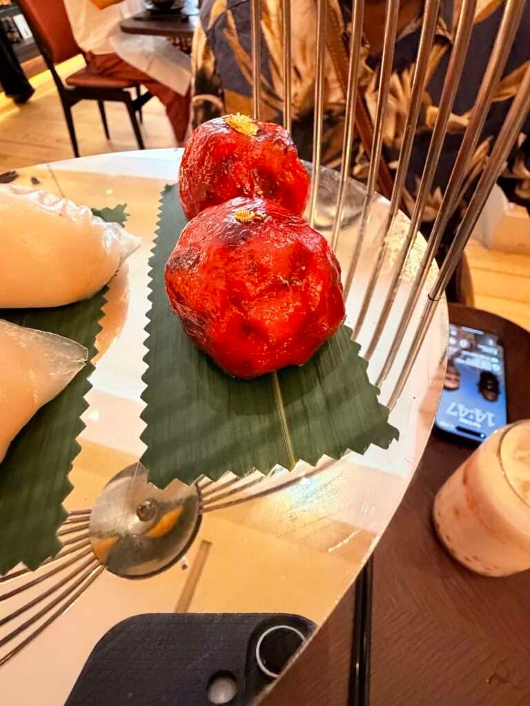 Molly from Mollywozhere travel blog showing an afternoon tea with a twist at the Dim Sum Library, London.