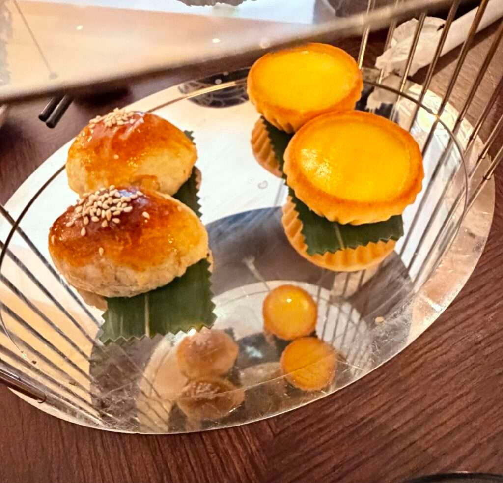 Molly from Mollywozhere travel blog showing classic tart from her asian afternoon tea with twist at the Dim Sum Library, London.