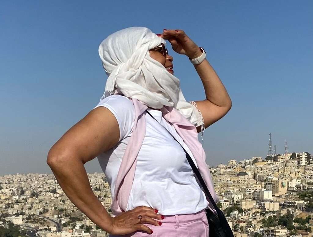 Molly from Mollywozhere travel blog looking across the city of Amman Citadel, Jordan,from the Citadel..