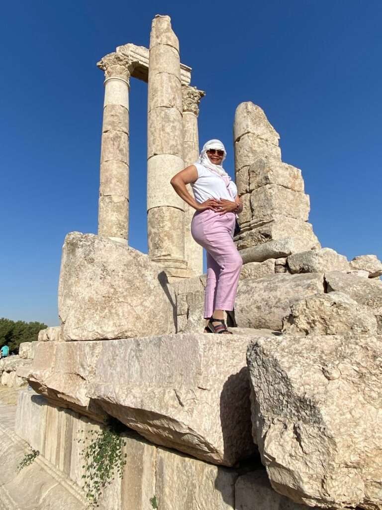 Molly from Mollywozhere travel blog standing in front of the Temple of Hercules, Amman Citadel, Jordan.